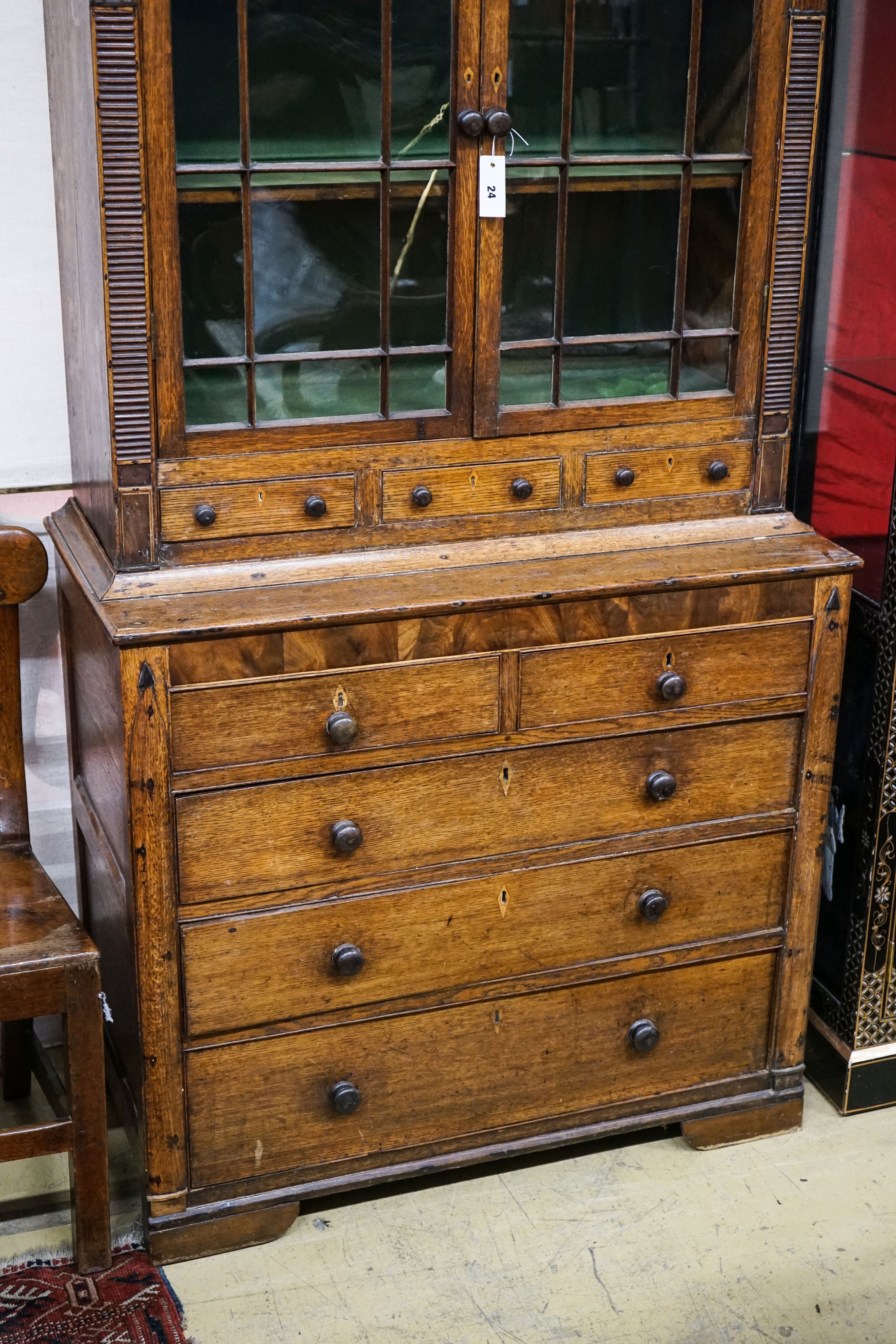 A George IV oak and mahogany bookcase on chest, width 97cm, depth 47cm, height 202cm